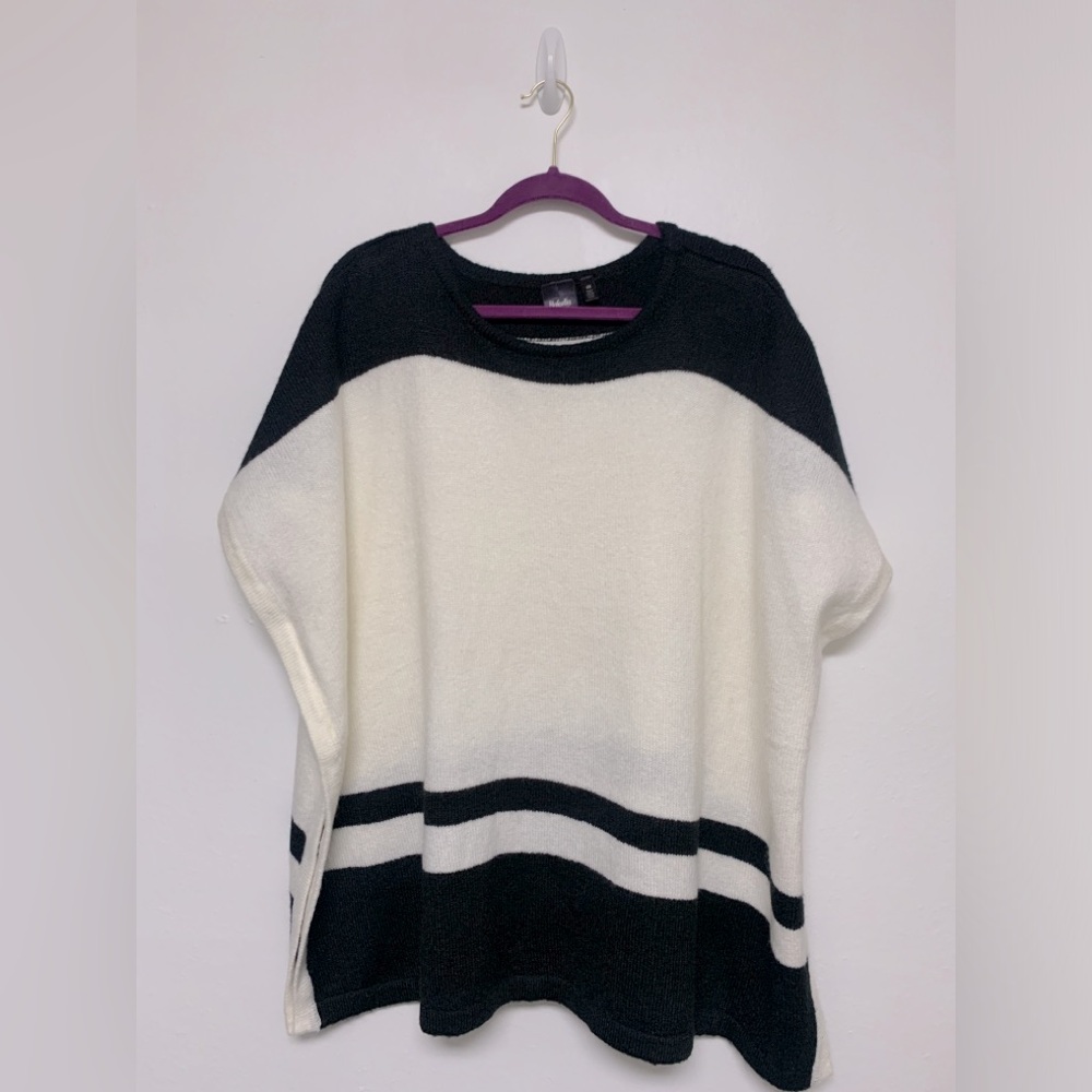 Rafaella poncho. It’s one size but fits well for sizes small to large.